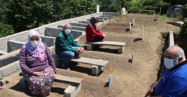 Members of the Genç family are seen at the family cemetery in the district of Güneysu, Rize, northeastern Turkey, Feb. 20, 2022. (DHA Photo)