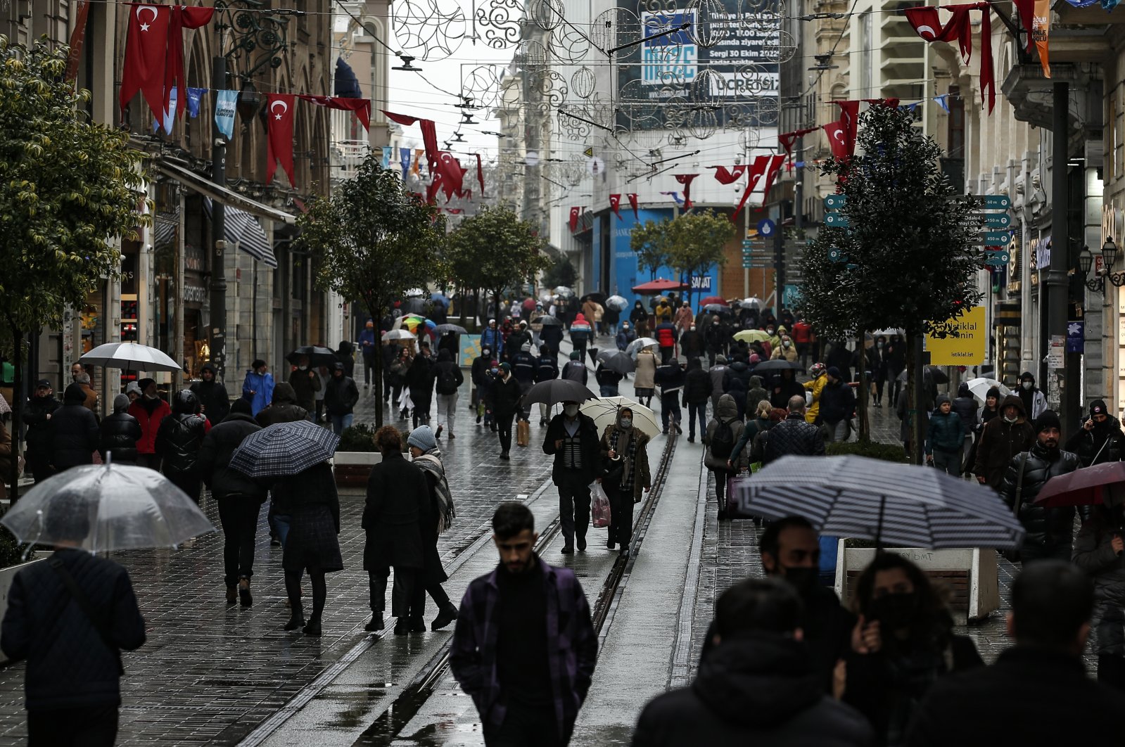 People walk in the rain in Istanbul, Turkey, Feb. 3, 2022. (AP Photo)