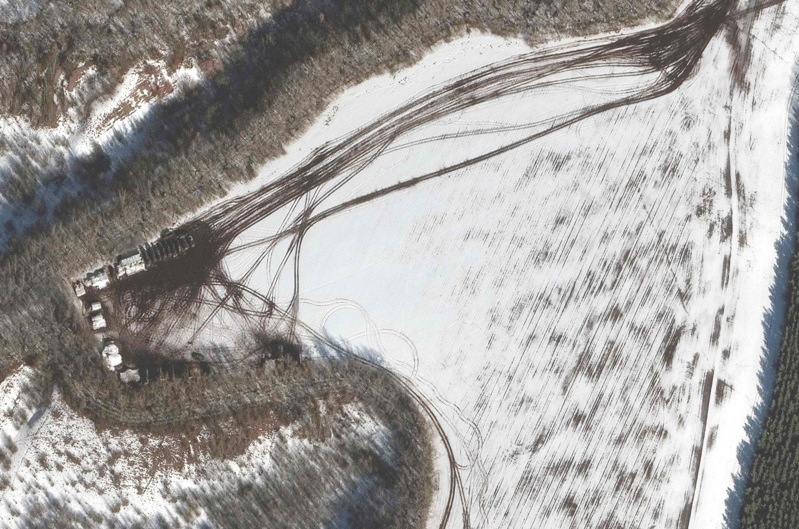 This Maxar satellite image taken and released on Feb. 20, 2022, shows deployment along the treeline near Belgorod, Russia. (Photo by satellite image from Maxar Technologies / AFP)