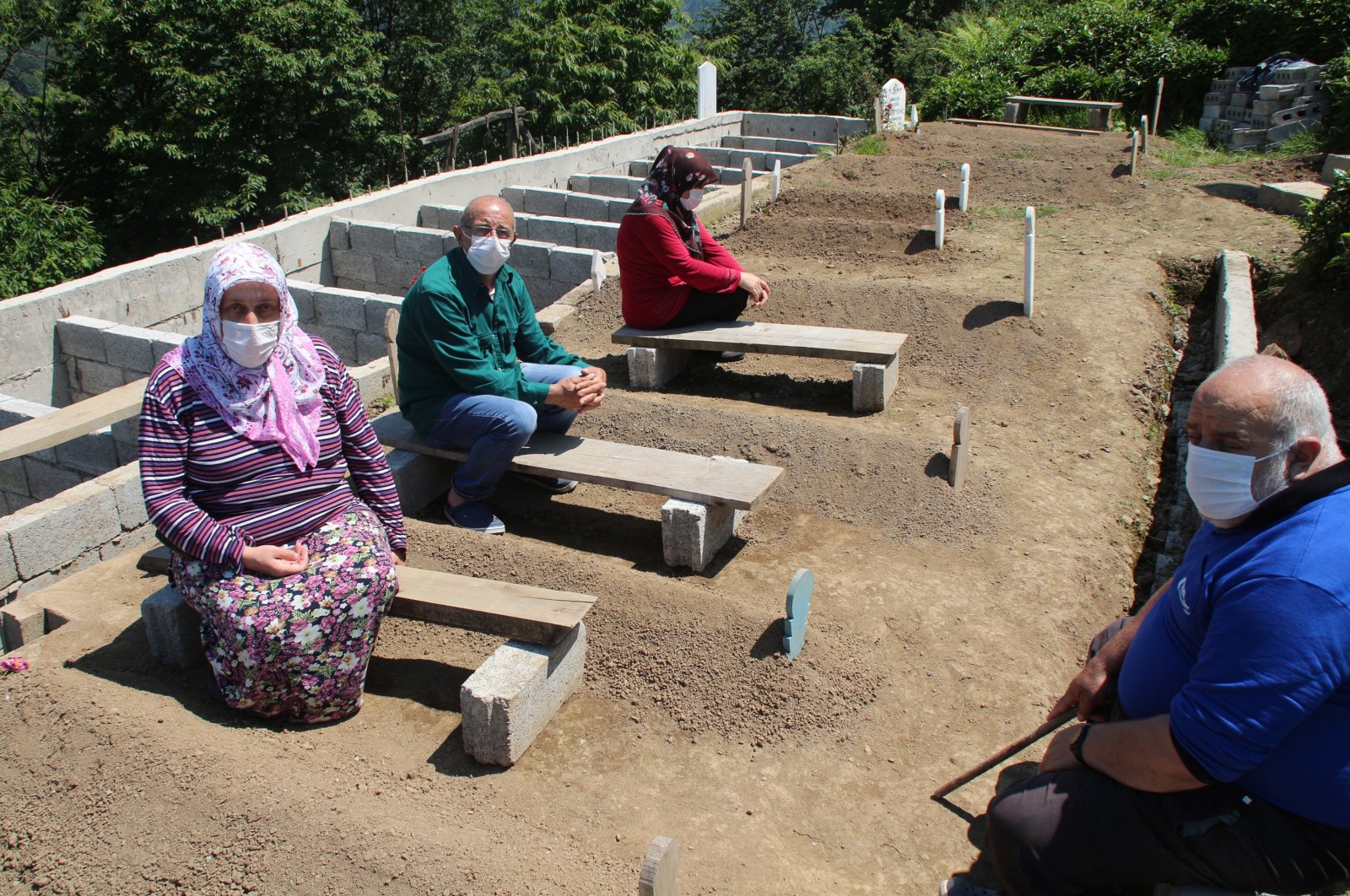 Members of the Genç family are seen at the family cemetery in the district of Güneysu, Rize, northeastern Turkey, Feb. 20, 2022. (DHA Photo)