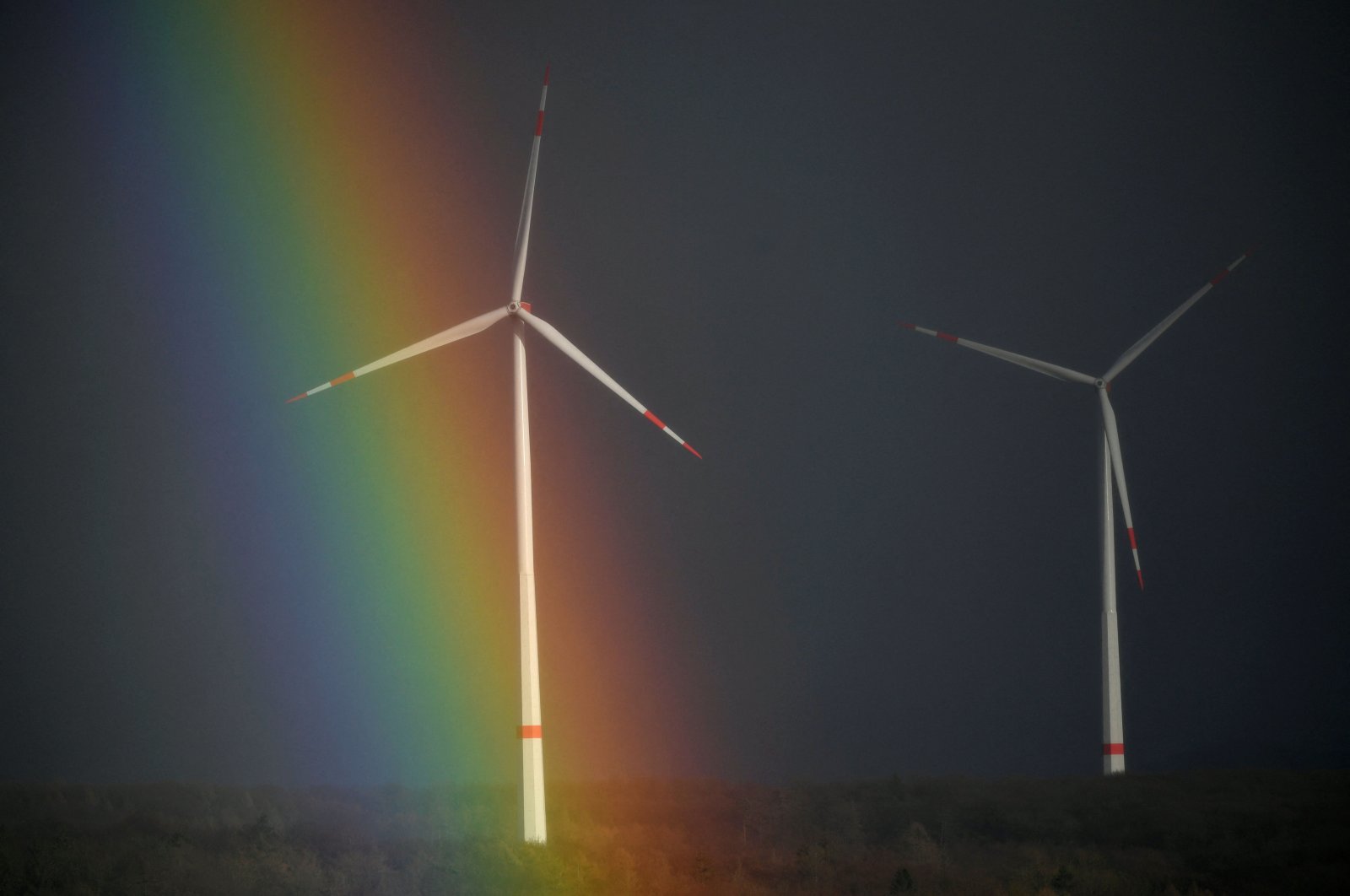A rainbow is seen behind wind turbines near Breuna, western Germany, Feb. 17, 2022. (AFP Photo)