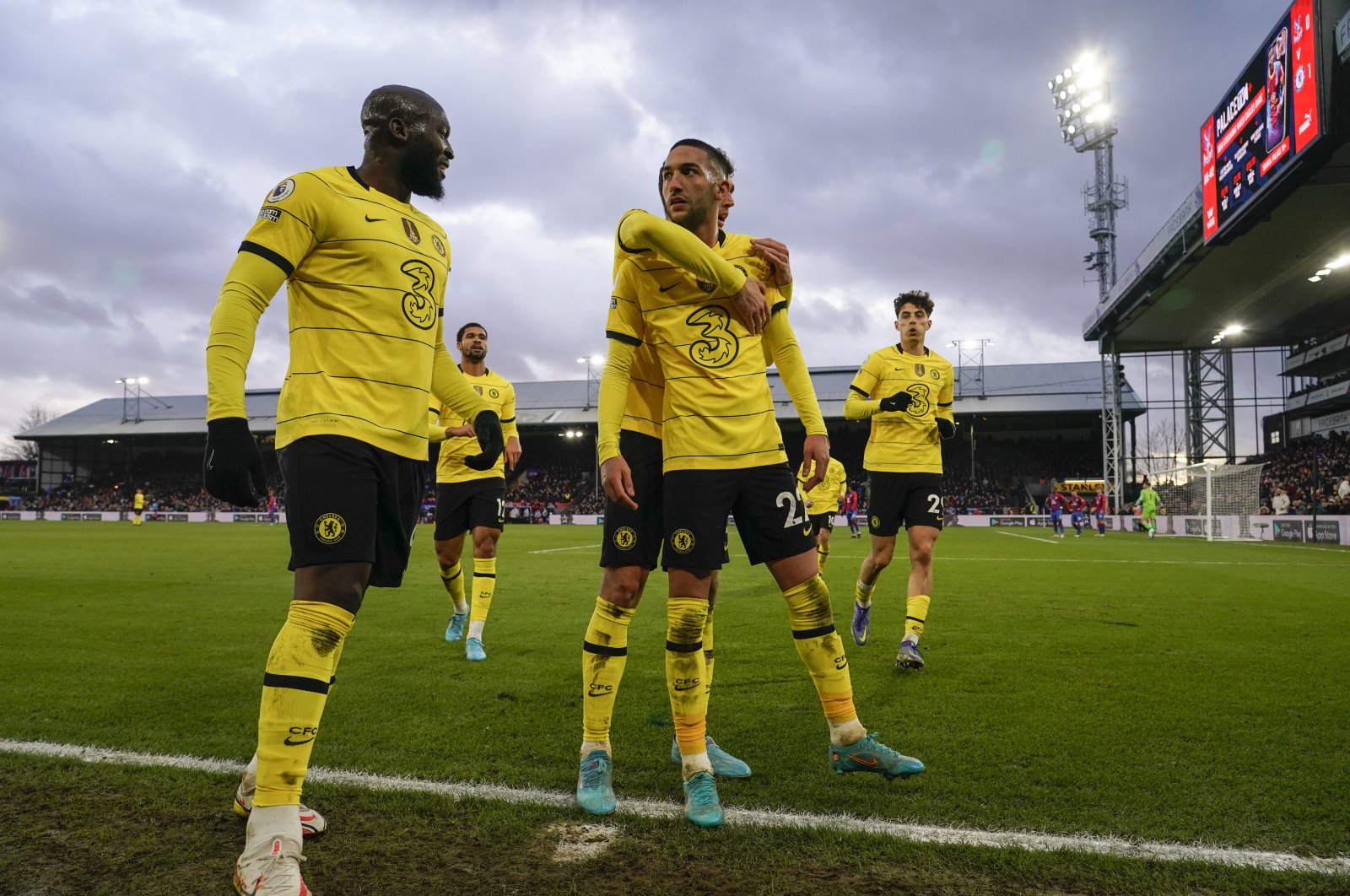 Chelsea players celebrate with Hakim Ziyech (C) after he scored a goal in a Premier League match against Crystal Palace, London, Feb. 19, 2022. (AP Photo)