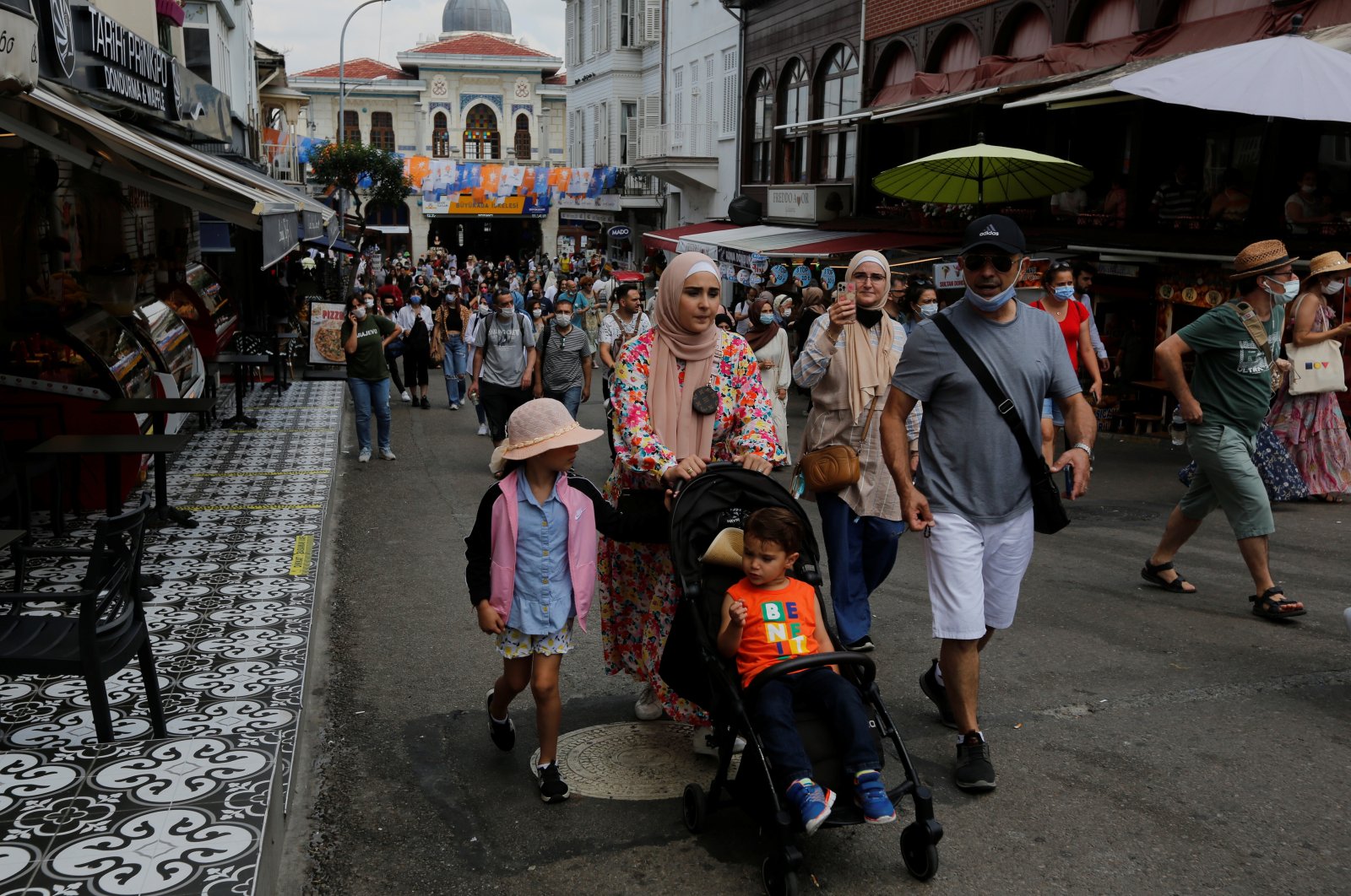 Foreign tourists visit Büyükada, the largest of the Princes&#039; Islands in the Marmara Sea, off Istanbul, Turkey, July 14, 2021. (Reuters Photo)