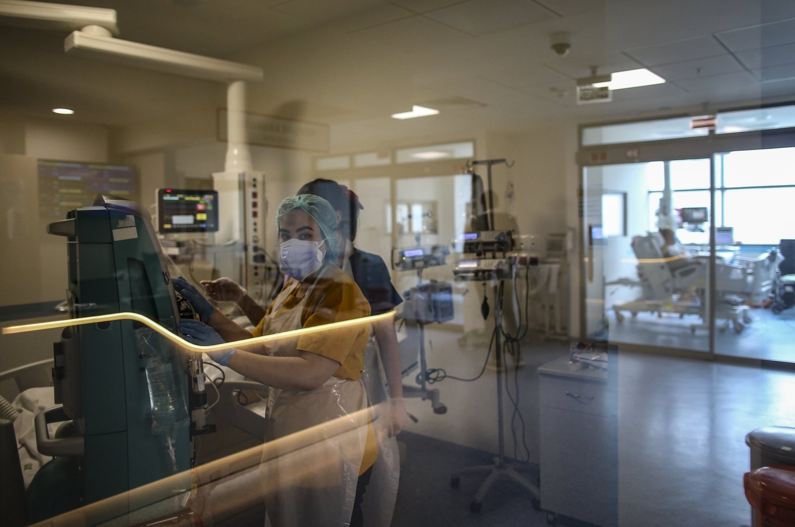 Medical personnel tend to a patient infected with COVID-19 at the intensive care unit of the Cemil Tascıoğlu City Hospital in Istanbul, Turkey, Friday, April 9, 2021. (AP Photo)