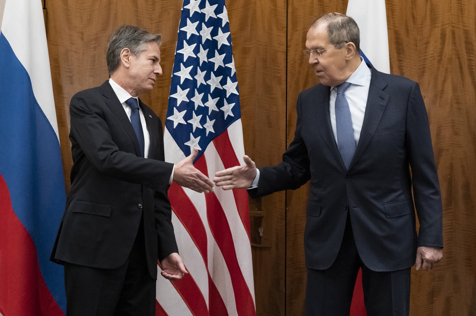 U.S. Secretary of State Antony Blinken, left, greets Russian Foreign Minister Sergey Lavrov before their meeting, in Geneva, Switzerland, Friday, Jan. 21, 2022. (AP Photo)
