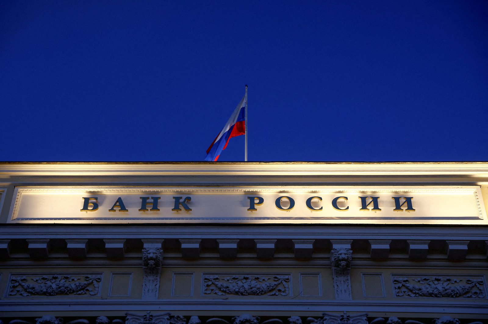 A Russian state flag flies over the Central Bank headquarters in Moscow, Russia March 29, 2021. (Reuters Photo)