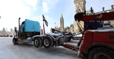 A protester&amp;#039;s truck is towed away after police cleared the street of demonstrators in Ottawa, Ontario, Canada, Feb. 19, 2022. (AFP Photo)