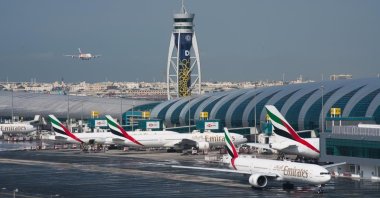 An Emirates jetliner comes in for landing at the Dubai International Airport in Dubai, United Arab Emirates, Dec. 11, 2019. (AP Photo)