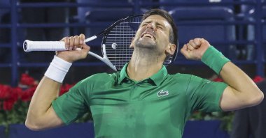 Novak Djokovic celebrates after winning an ATP Dubai Tennis Championships match against Lorenzo Musetti, Dubai, UAE, Feb. 21, 2022. (AFP Photo)