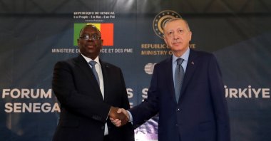 President Recep Tayyip Erdoğan and Senegal's President Macky Sall shake hands during the Senegal-Turkey Business Forum in Dakar, Senegal, Feb. 21, 2022. (Presidential Press Office via EPA)