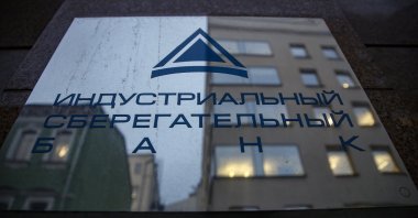 A signboard of the Industrial Savings Bank (IS-bank) on the headquarters building in Moscow, Russia, Feb. 22, 2022. (EPA Photo)