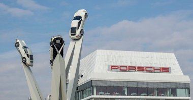 The sculpture "Inspiration 911," showing three Porsche 911 sportscars from different generations is seen in front of the headquarters of German luxury carmaker Porsche AG in Stuttgart, southwestern Germany, Feb. 21, 2019. (AFP Photo)
