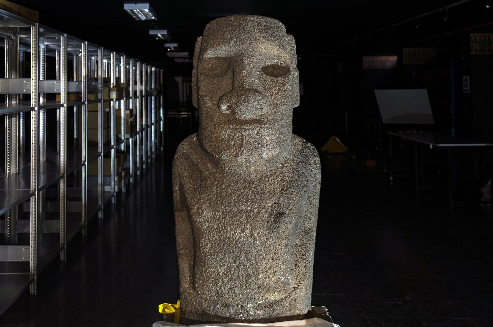 A Moai Tau statue sits inside the Natural History Museum during a ceremony in Santiago, Chile, before it is returned to Chile&#039;s Easter Island, Feb. 21, 2022. (AP Photo)