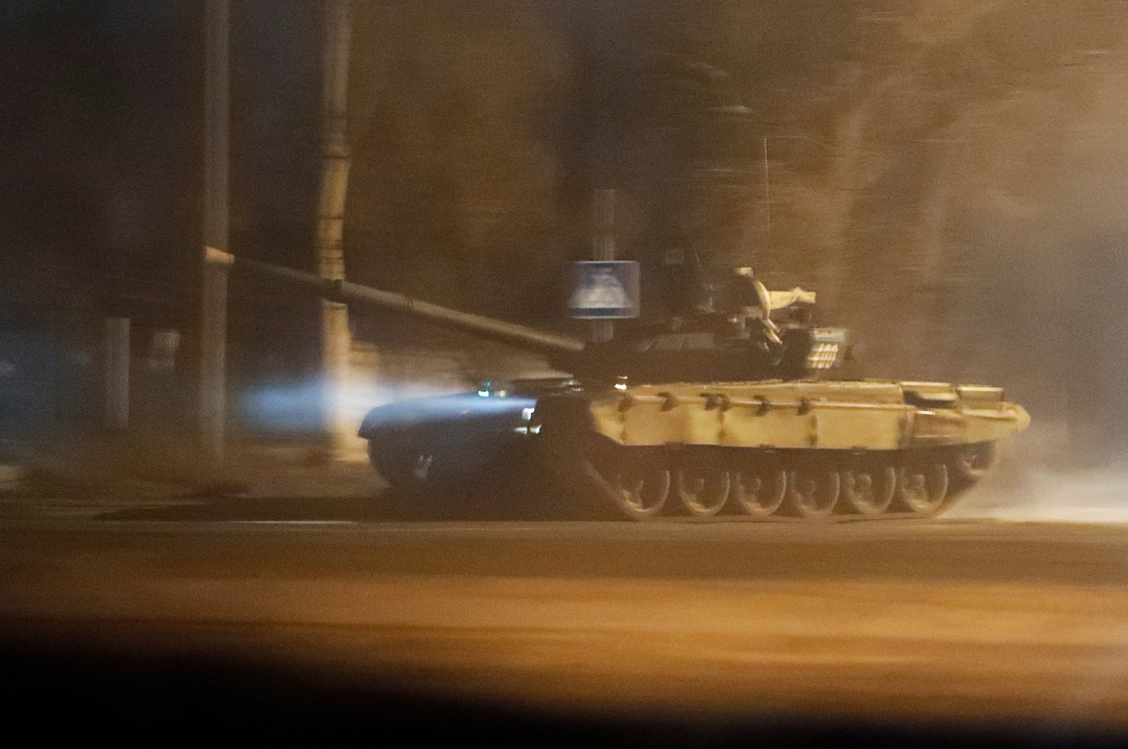 A tank drives along a street after Russian President Vladimir Putin ordered the deployment of Russian troops to two breakaway regions in eastern Ukraine following the recognition of their independence, in the separatist-controlled city of Donetsk, Ukraineb Feb. 22, 2022. (Reuters Photo)