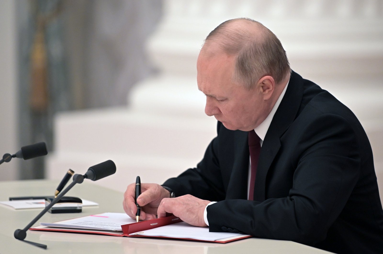 Russian President Vladimir Putin signs decrees on the recognition of the self-proclaimed Donetsk People&#039;s Republic (DPR) and the Luhansk People&#039;s Republic (LNR) in the Moscow Kremlin, Moscow, Russia, Feb. 21, 2022. (EPA Photo)