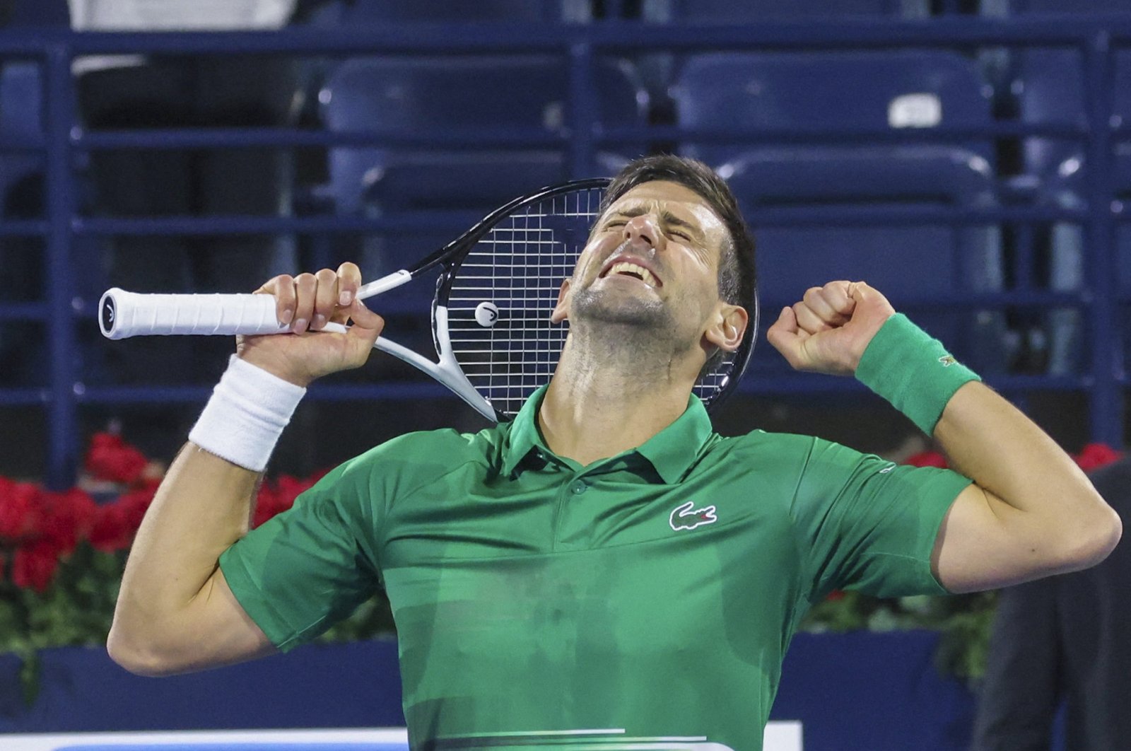 Novak Djokovic celebrates after winning an ATP Dubai Tennis Championships match against Lorenzo Musetti, Dubai, UAE, Feb. 21, 2022. (AFP Photo)