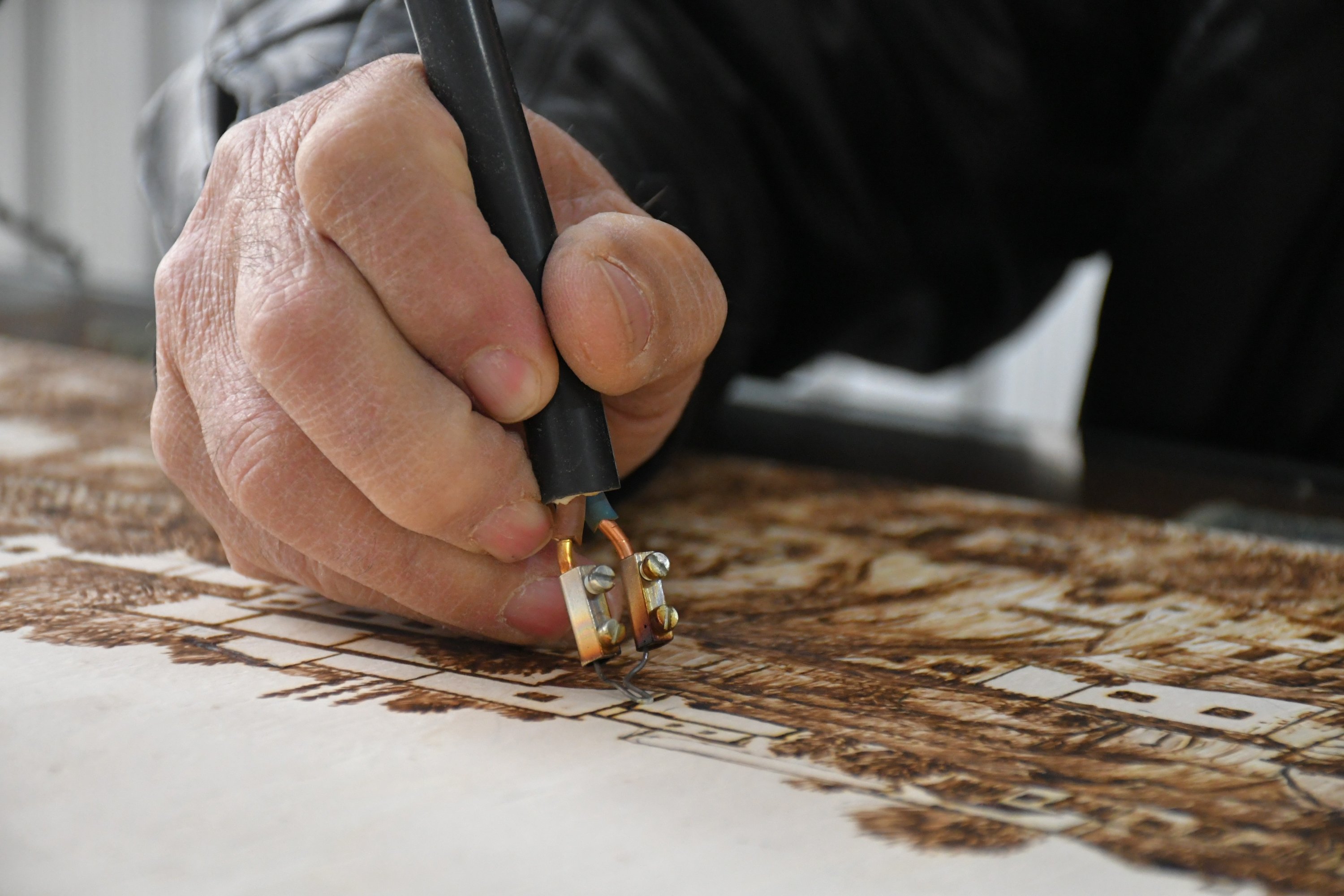 Self-taught woodcarver Yılmaz Öngün at work etching a piece, Aksaray, central Turkey, Feb. 20, 2022. (IHA Photo)