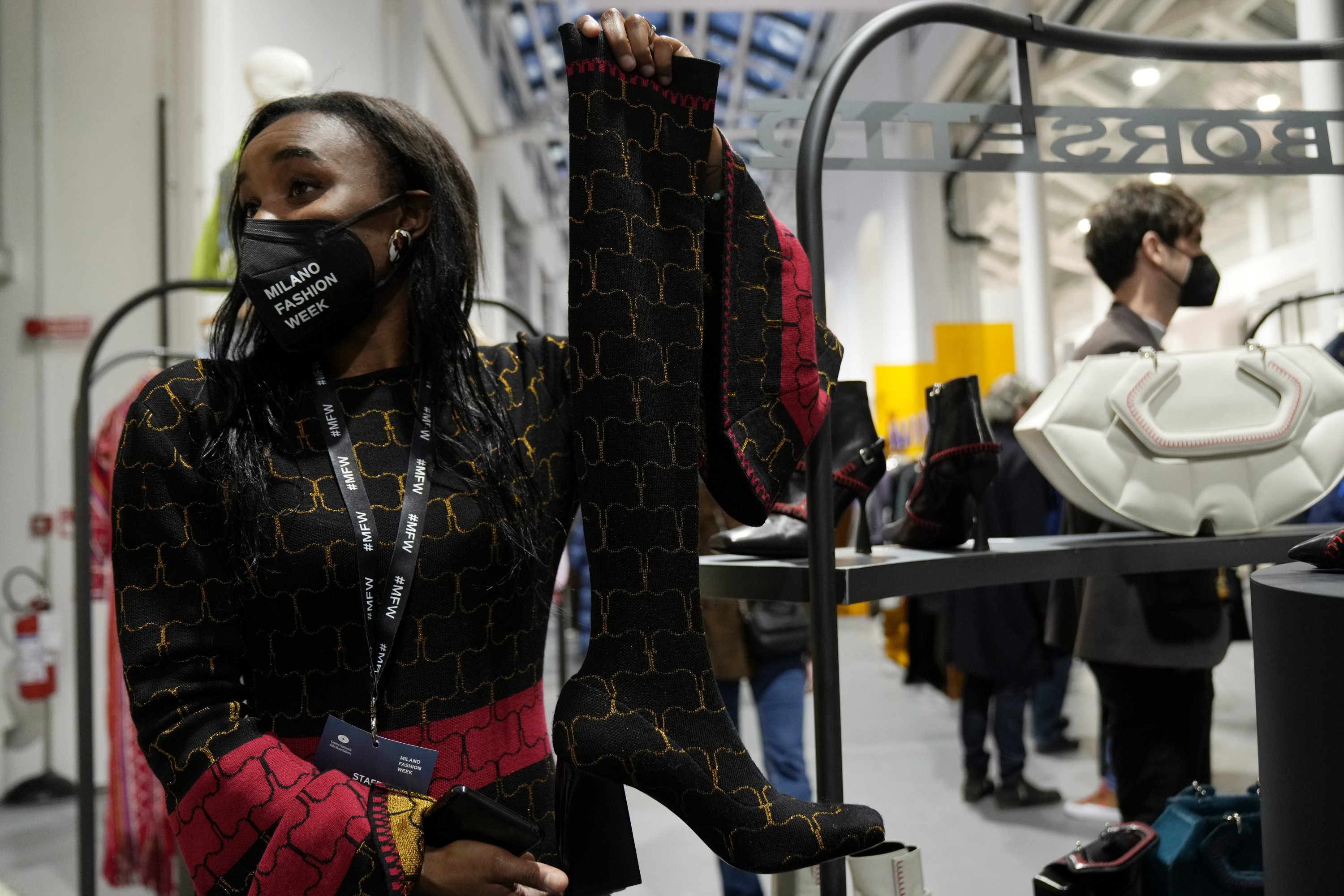 Fashion designer Judith Borsetto, from Haiti, founder of label Judith Saint Jermain, shows her creations, part of the We Are Made in Italy Spring Summer 2022 collective fashion event, unveiled during the Milan Fashion Week, Italy, Feb. 22, 2022. (AP Photo)