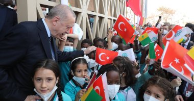 President Recep Tayyip Erdoğan with children during the inauguration ceremony of an official building of Turkey&#039;s Dakar Embassy, in Dakar, Senegal, Feb. 2, 2022. (AA Photo)
