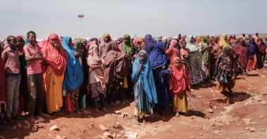 People wait for food distributions and health services at a camp for internally displaced persons (IDPs) in Baidoa, Somalia, on Feb. 14, 2022. (AFP Photo)
