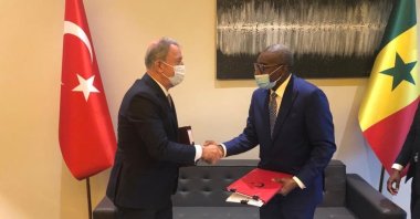 Defense Minister Hulusi Akar shakes hands with Senegalese counterpart Sidiki Kaba after signing joint agreement, Feb. 22, 2022.