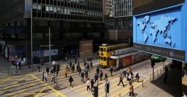Pedestrians walk on a crossing at the Central district in Hong Kong, China, Feb. 23, 2022. (Reuters Photo)