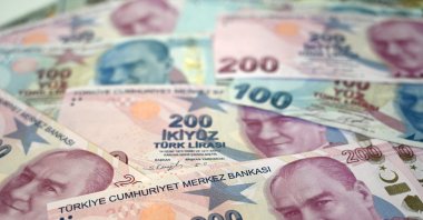 Turkish lira banknotes on display in Istanbul, Turkey, Dec. 7, 2021, (Photo by Ozan KOSE / AFP)