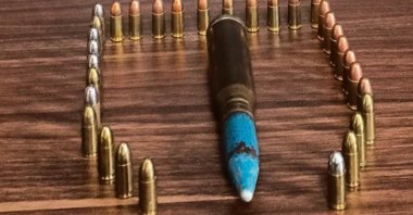 An anti-aircraft bullet and pistol bullets are seen on the table, Muğla, Turkey, Feb. 23, 2022. (IHA Photo)