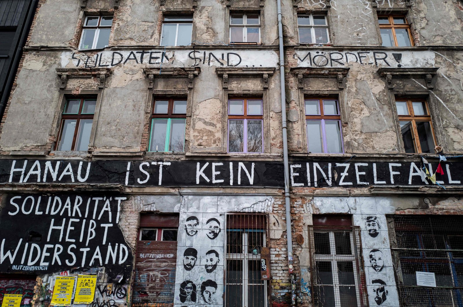 The words &quot;Hanau ist kein Einzelfall&quot; (Hanau is not an isolated event) are painted on the facade of a squatted building in Berlin, Germany, Feb. 22, 2022. (AFP Photo)
