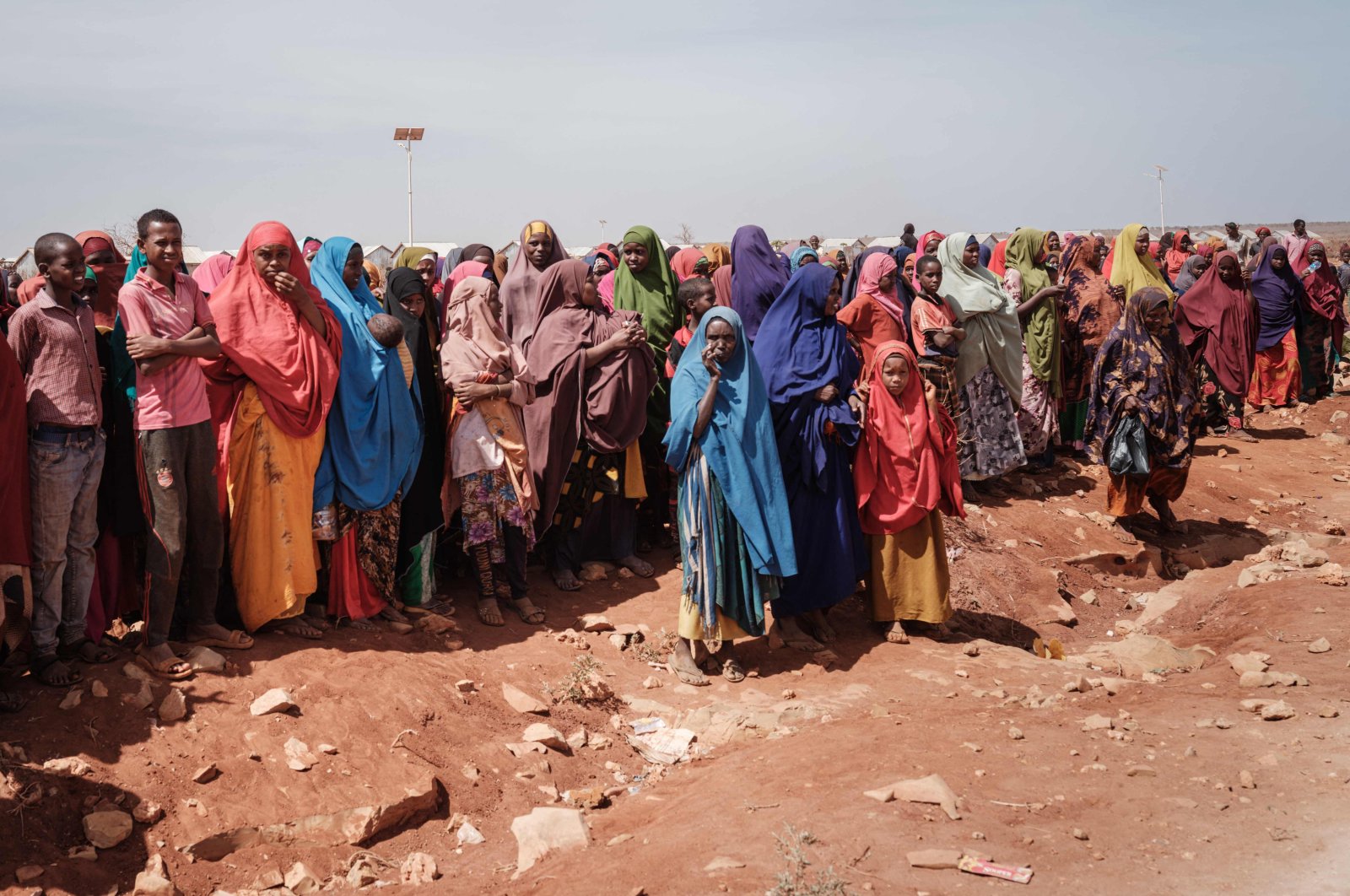 People wait for food distributions and health services at a camp for internally displaced persons (IDPs) in Baidoa, Somalia, on Feb. 14, 2022. (AFP Photo)