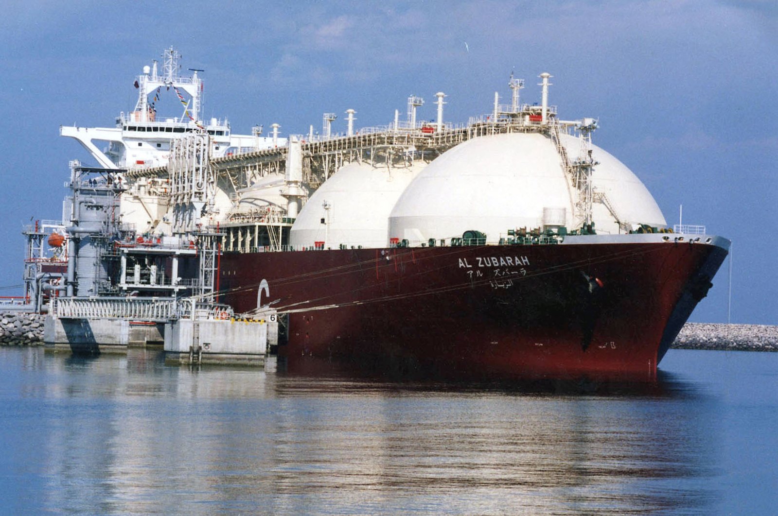 A Qatari liquid natural gas (LNG) tanker ship is loaded with LNG at Raslaffans Sea Port, northern Qatar, in this undated file photo. (AP Photo)