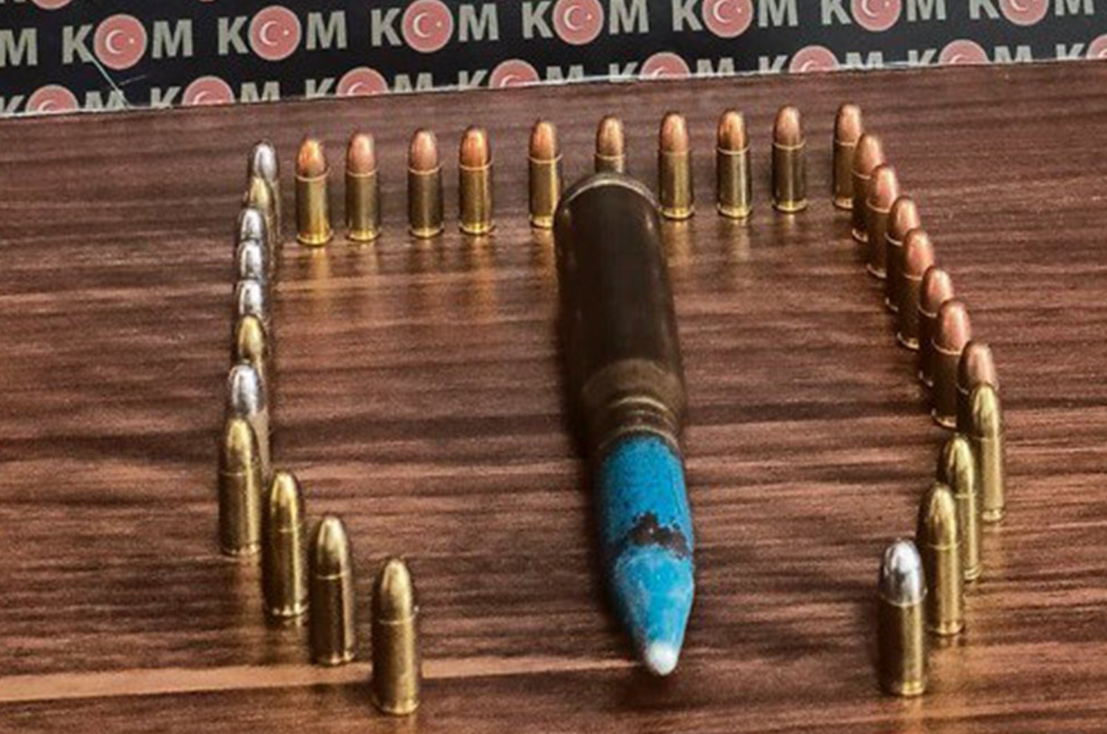 An anti-aircraft bullet and pistol bullets are seen on the table, Muğla, Turkey, Feb. 23, 2022. (IHA Photo)