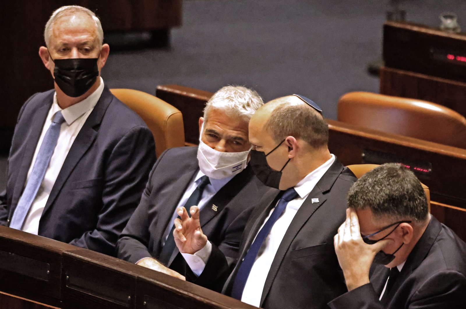 (L to R) Israeli Defense Minister Benny Gantz, Foreign Minister Yair Lapid, Prime Minister Naftali Bennett and Justice Minister Gideon Saar attend a plenum session in the presence of the speaker of the United States House of Representatives in the Knesset (Israeli Parliament), in West Jerusalem, Israel, Feb. 16, 2022. (AFP Photo)