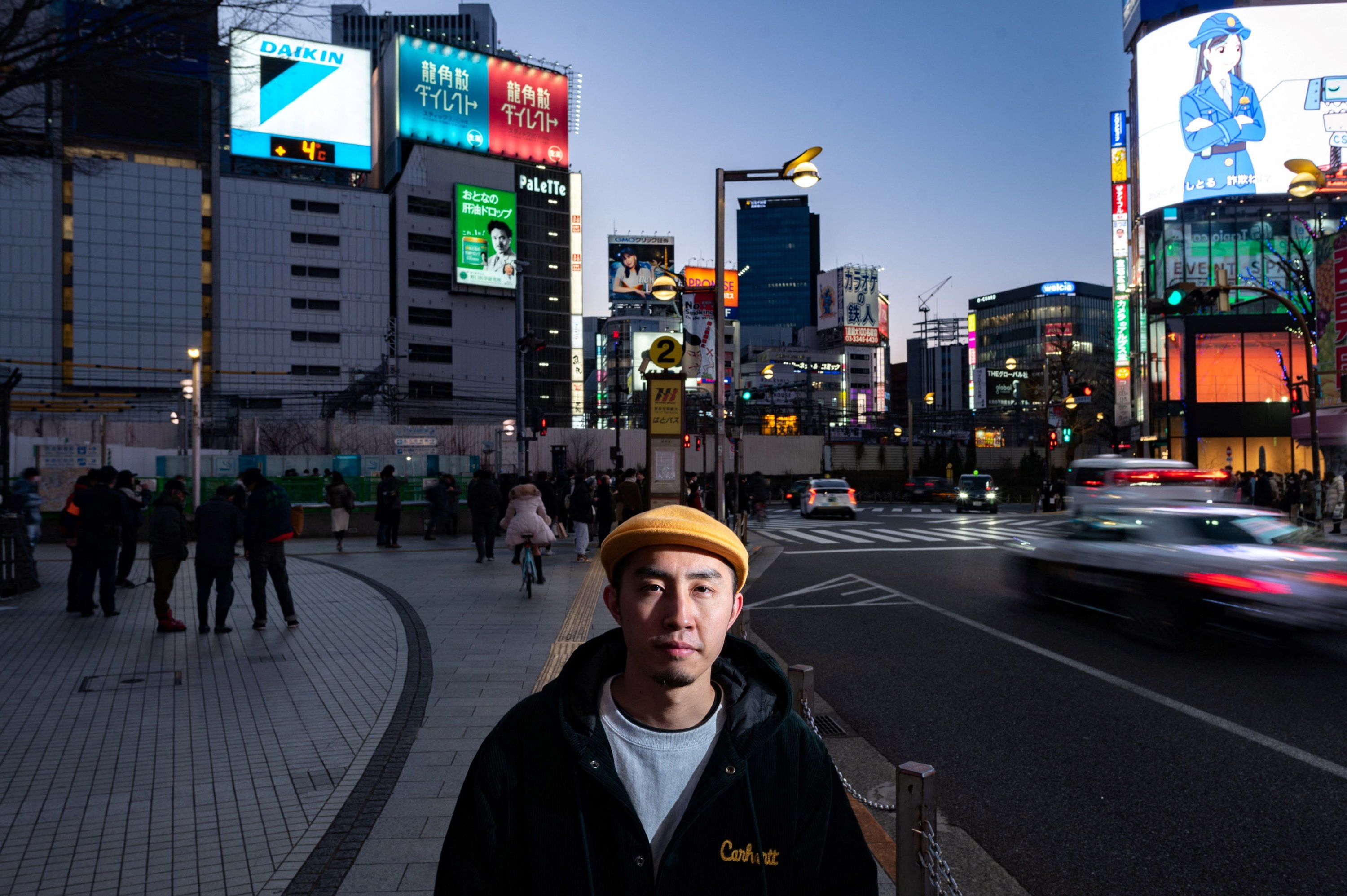 DJ Kei Notoya, who has collected around City Pop 3,000 records, poses for a photo in the Shinjuku district of Tokyo, Japan, Feb. 6, 2022. (AFP)