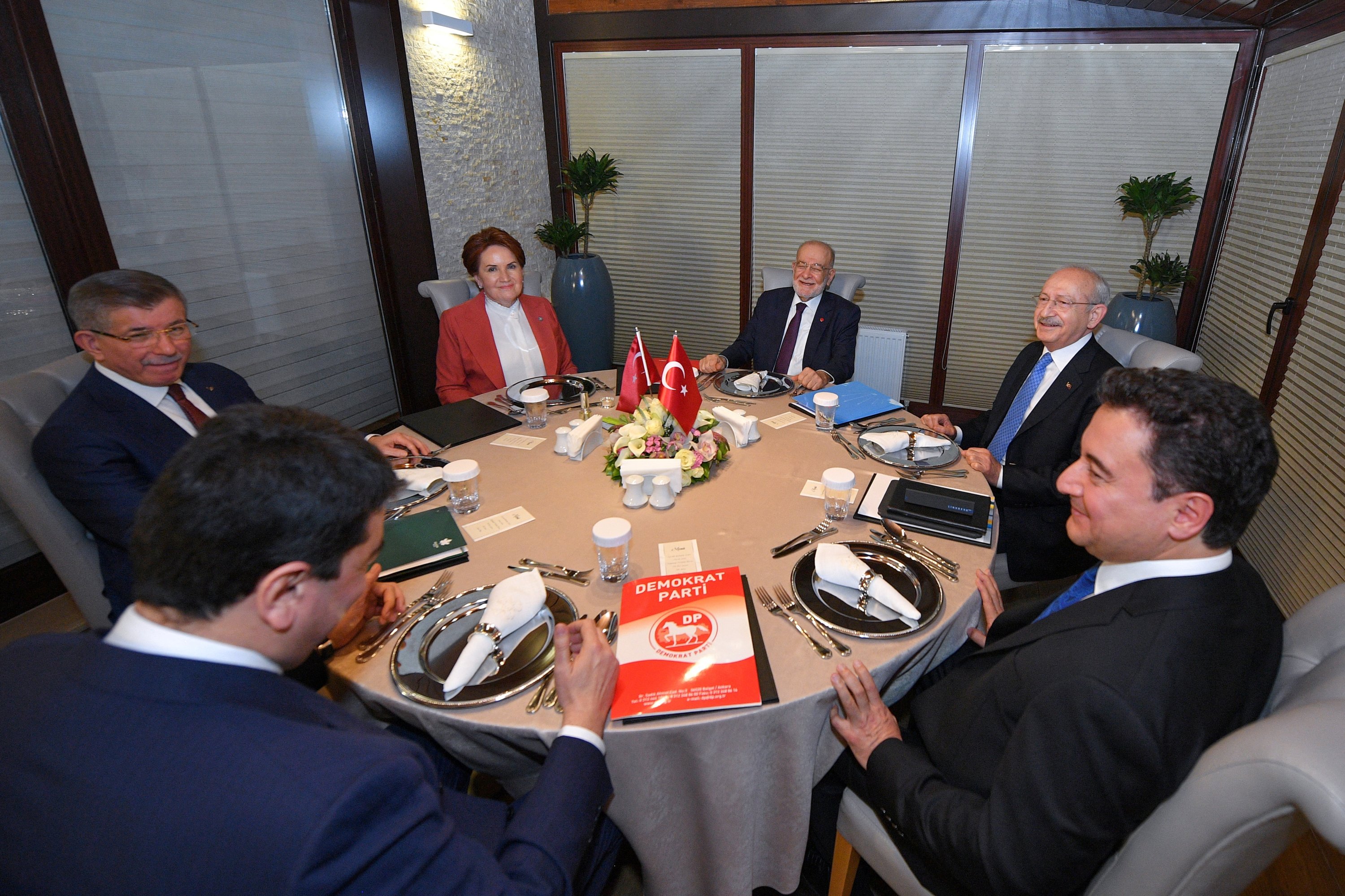 Representatives from Turkey's six opposition parties (L-R): Democrat Party (DP) Chairperson Gültekin Uysal, Future Party (GP) Chairperson Ahmet Davutoğlu and Good Party (IP) Chairperson Meral Akşener, Felicity Party (SP) Chairperson Temel Karamollaoğlu, the Republican People's Party (CHP) Chairperson Kemal Kılıçdaroğlu and Democracy and Progress Party (DEVA) Chairperson Ali Babacan pose ahead of a meeting at the Çankaya Municipality facilities, in capital Ankara, Turkey, Feb. 12, 2022. (Reuters Photo)