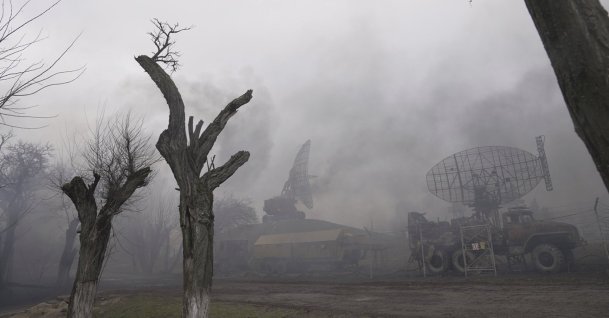Smoke rises from an air defense base in the aftermath of an apparent Russian strike in Mariupol, Ukraine, Thursday, Feb. 24, 2022. (AP Photo)