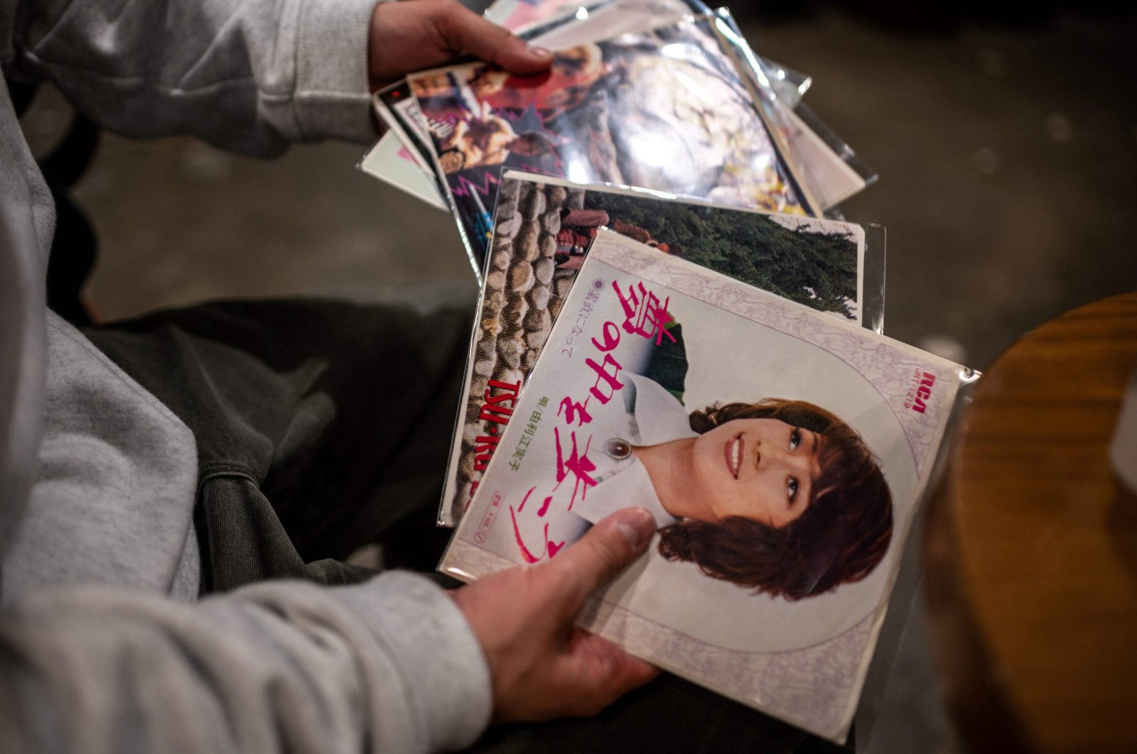DJ Kei Notoya, who has collected around City Pop 3,000 records, looks through various Japanese records from the 1970s and 1980s in Tokyo, Japan, Feb. 6, 2022. (AFP)