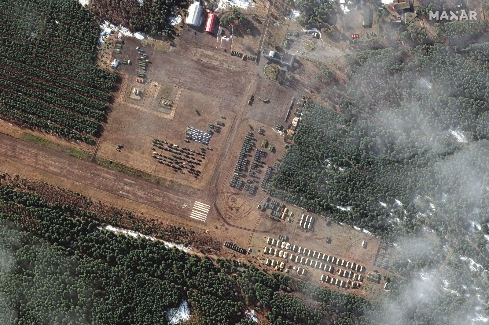 A handout satellite image made available by Maxar Technologies shows an overview of new Russian deployment at V.D Bolshoy Bokov airfield near Mazyr, Belarus, Feb. 22, 2022.  (EPA Photo)