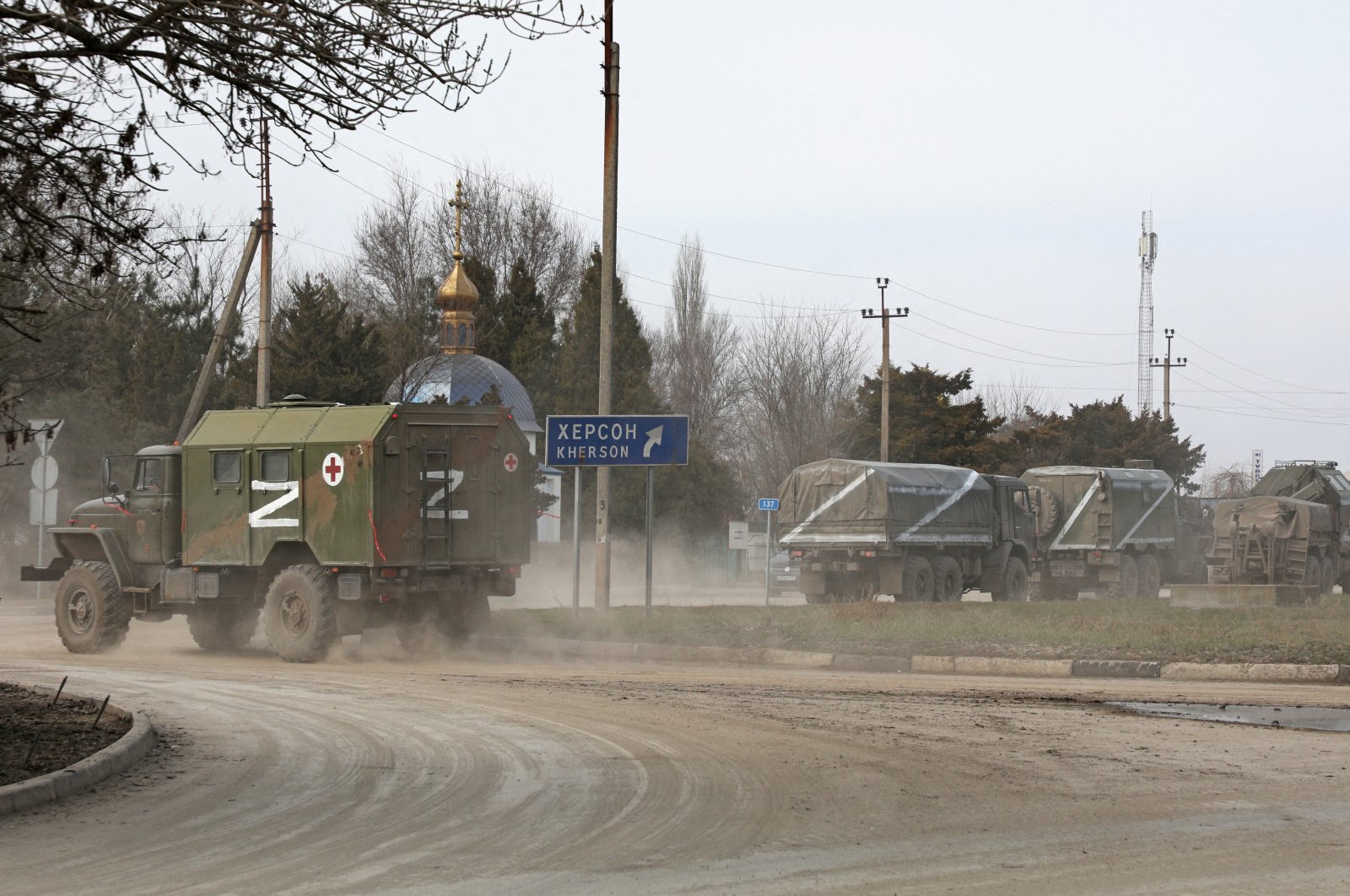 Russian Army military vehicles with the letter &#039;Z&#039; on them drive along a street, after Russian President Vladimir Putin authorized a military operation in eastern Ukraine, in the town of Armyansk, Crimea, Feb. 24, 2022. (Reuters Photo)