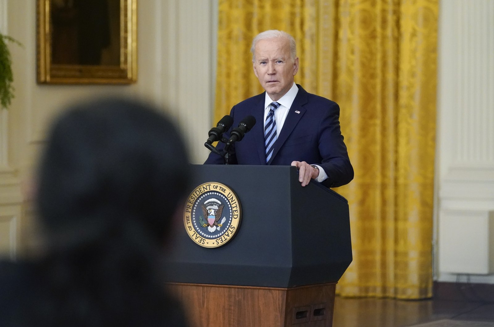 U.S. President Joe Biden listens to a question from a reporter while speaking about the Russian invasion of Ukraine in the East Room of the White House, Washington, Feb. 24, 2022. (AP Photo)
