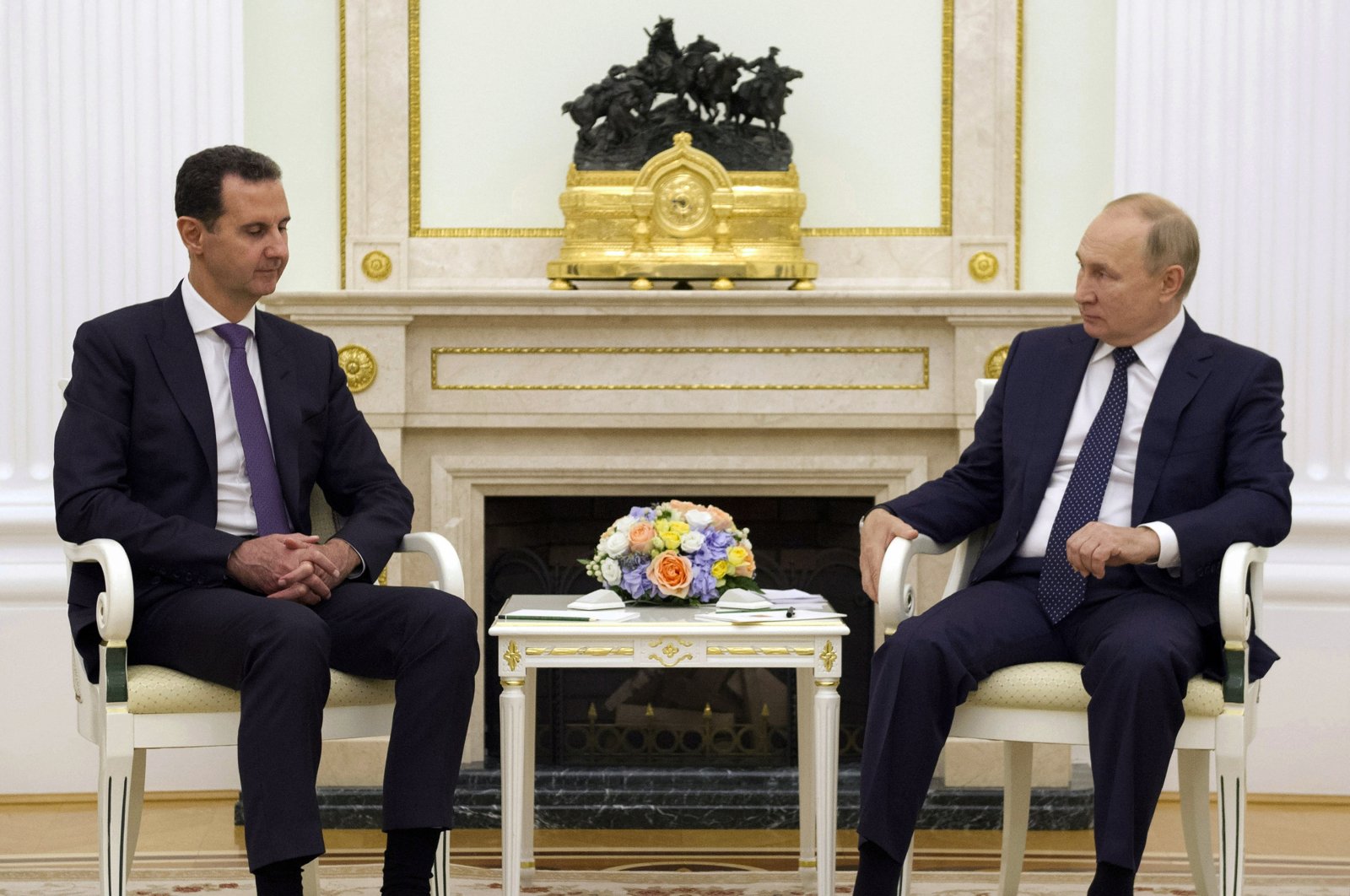 Russian President Vladimir Putin (R) listens to Syrian regime leader Bashar Assad during their meeting in the Kremlin in Moscow, Russia, Sept. 13, 2021.  (Kremlin Pool Photo via AP, File Photo)