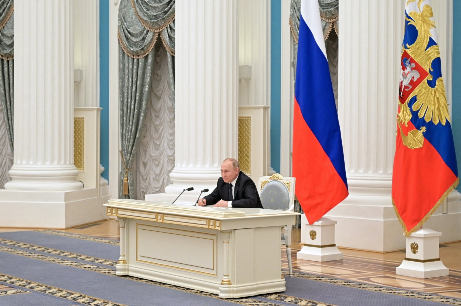 Russian President Vladimir Putin attends a meeting with representatives of the business community at the Kremlin in Moscow, Russia, Feb. 24, 2022. (Kremlin via Reuters)