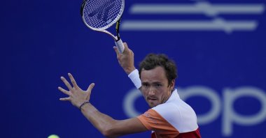 Daniil Medvedev returns a ball during a match against Yoshihito Nishioka at the quarterfinal at the Mexican Open tennis tournament in Acapulco, Mexico, Feb. 24, 2022. (AP Photo)