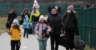 People arrive at the border crossing between Poland and Ukraine after Russia launched a massive military operation against Ukraine in Medyka, Poland, Feb. 25, 2022. (Reuters Photo)