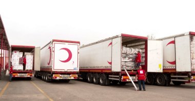 Turkish Red Crescent workers loading humanitarian aid on trucks, Turkey, Feb. 25, 2022. (AA PHOTO)
