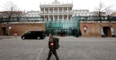 A member of the Austrian armed forces walks past Palais Coburg, the site of a meeting of the Joint Comprehensive Plan of Action (JCPOA), Vienna, Austria, Feb. 8, 2022.  (Reuters Photo)