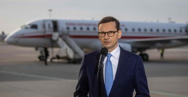 Polish Prime Minister Mateusz Morawiecki speaks to journalists at Warsaw Airport before leaving for Brussels for an emergency EU summit on the Russian invasion of Ukraine, Poland, Feb. 24, 2022. (AFP Photo)