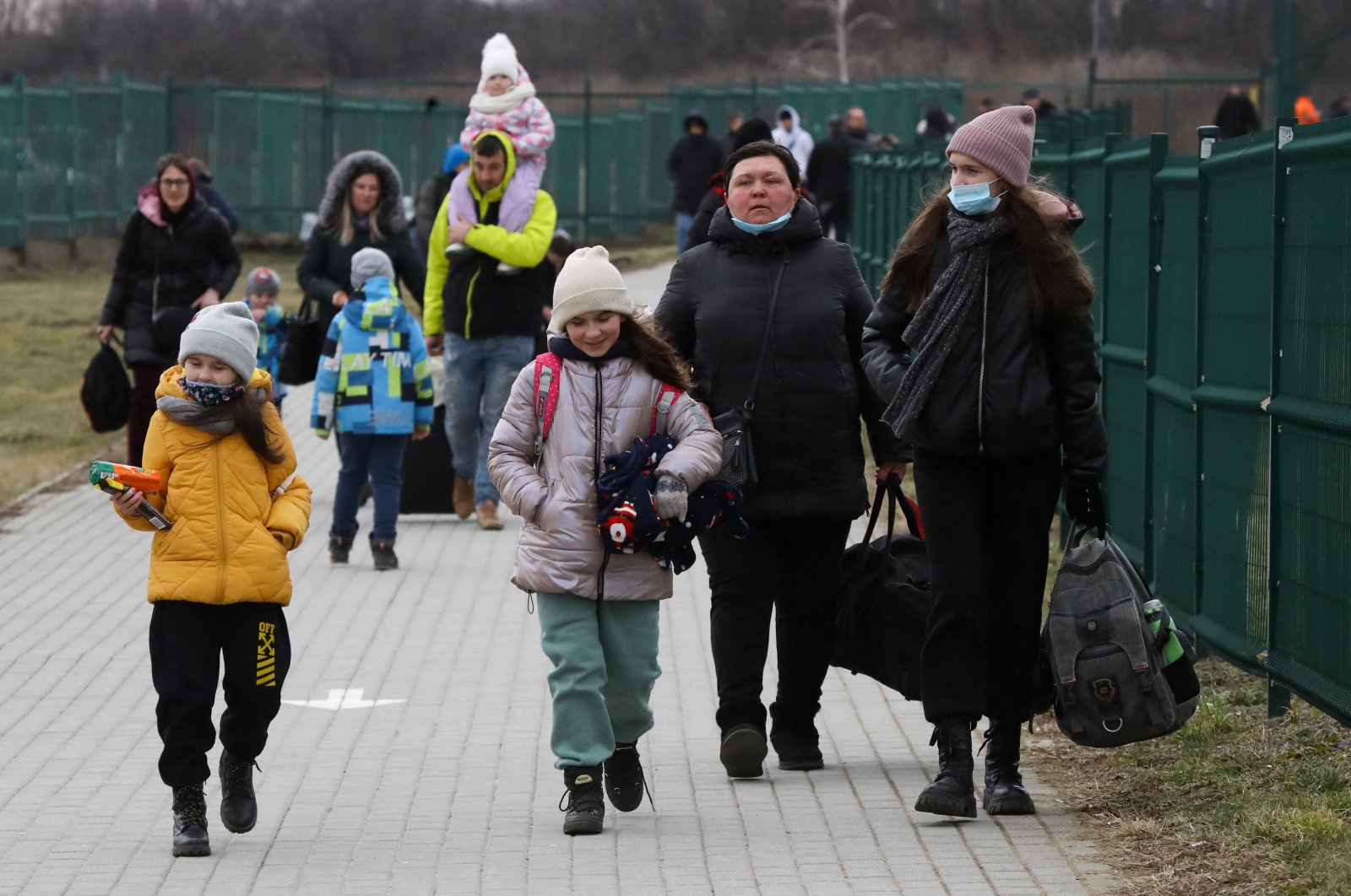 People arrive at the border crossing between Poland and Ukraine after Russia launched a massive military operation against Ukraine in Medyka, Poland, Feb. 25, 2022. (Reuters Photo)