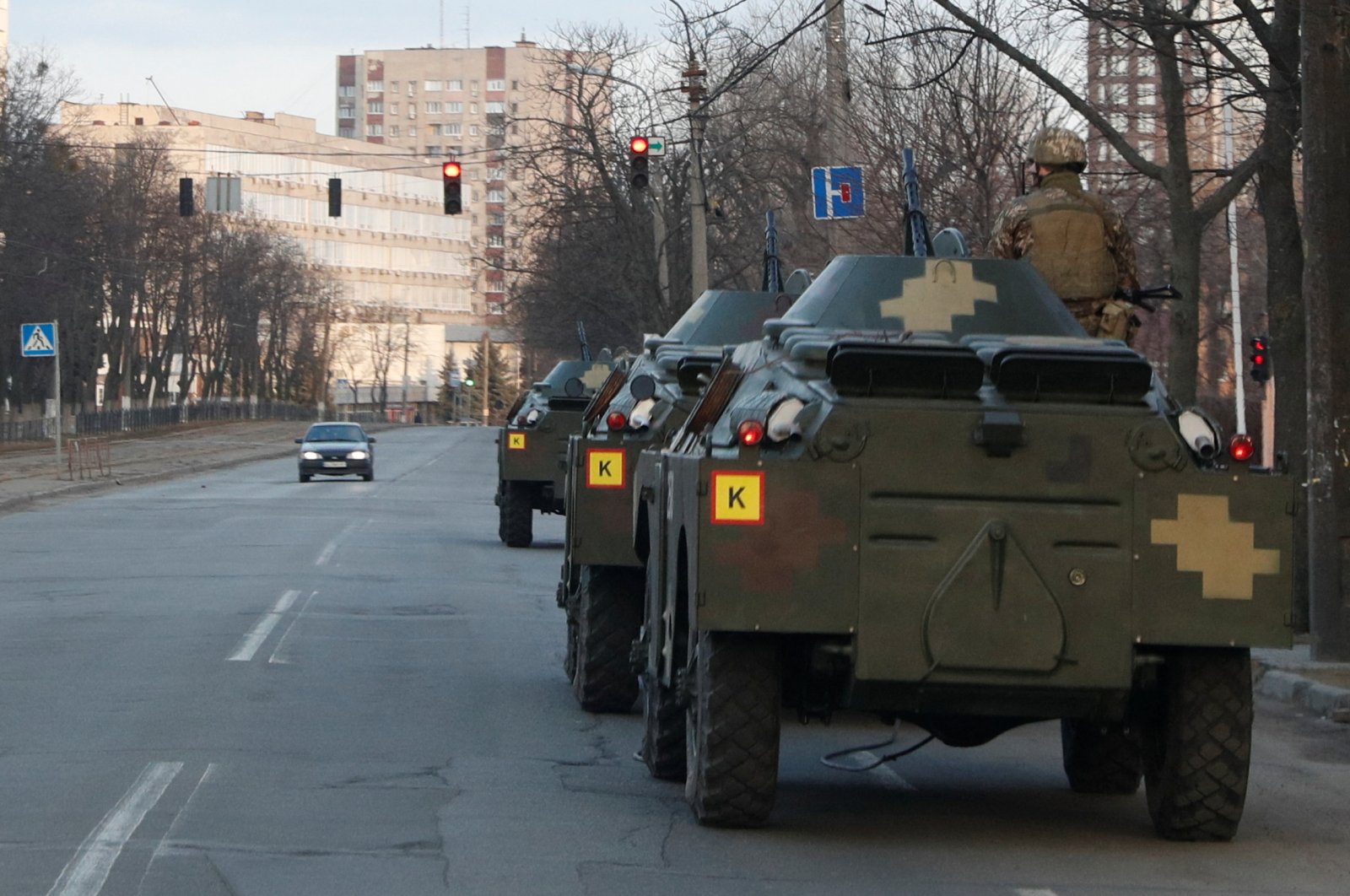 A Ukrainian service member is seen atop an armored personal carrier in Kyiv, Ukraine Feb. 25, 2022. (Reuters Photo)