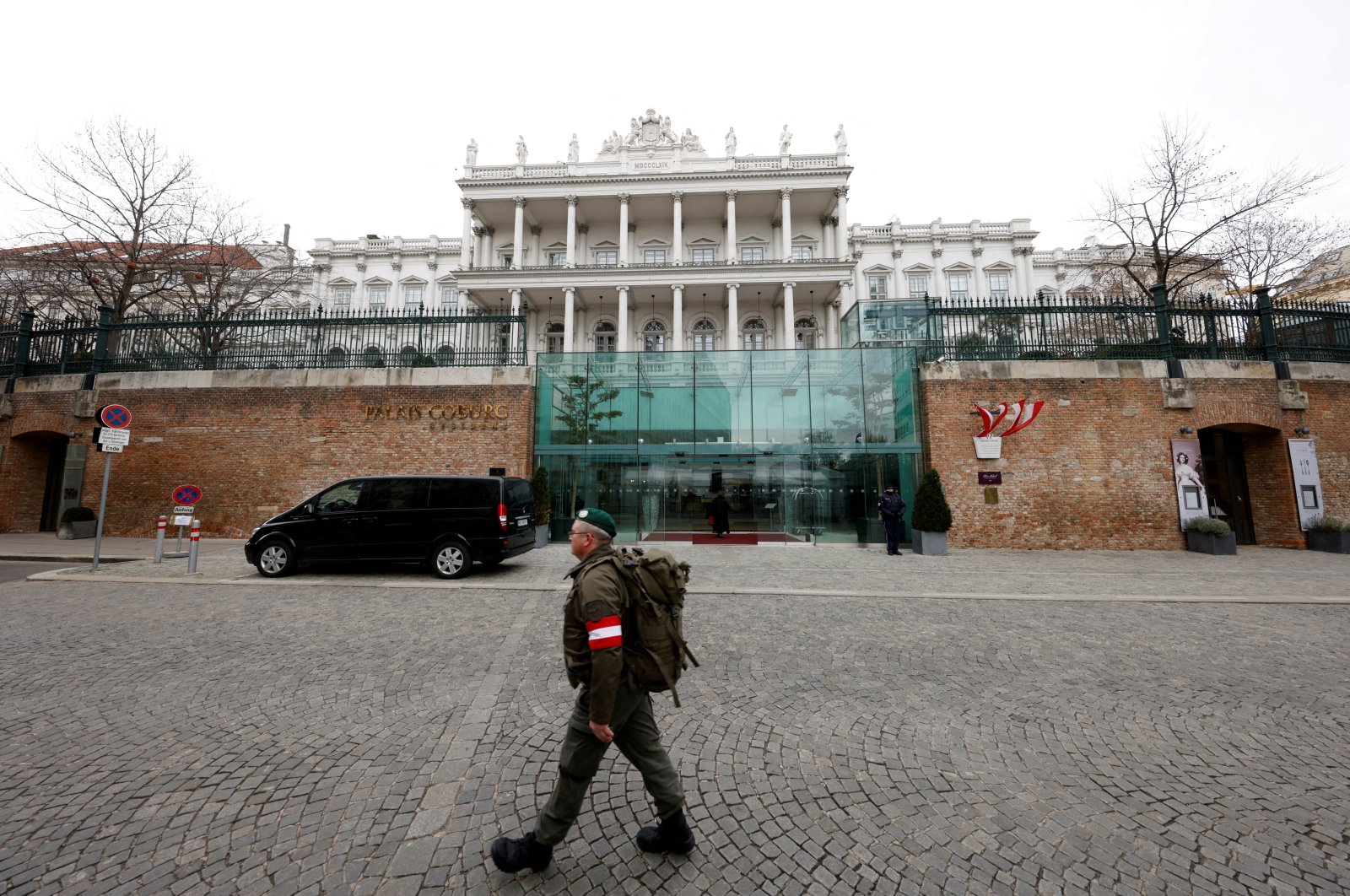 A member of the Austrian armed forces walks past Palais Coburg, the site of a meeting of the Joint Comprehensive Plan of Action (JCPOA), Vienna, Austria, Feb. 8, 2022.  (Reuters Photo)